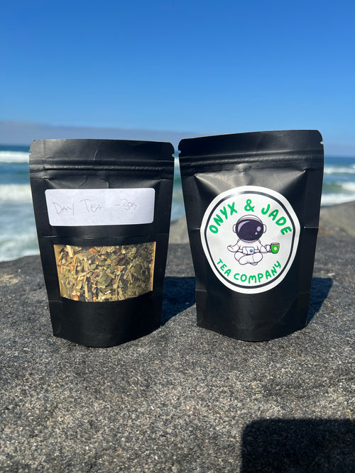 Front and back of the Onyx & Jade Tea Company Day Tea package showing the product label, ingredients, caffeine information, preparation directions, and package details.